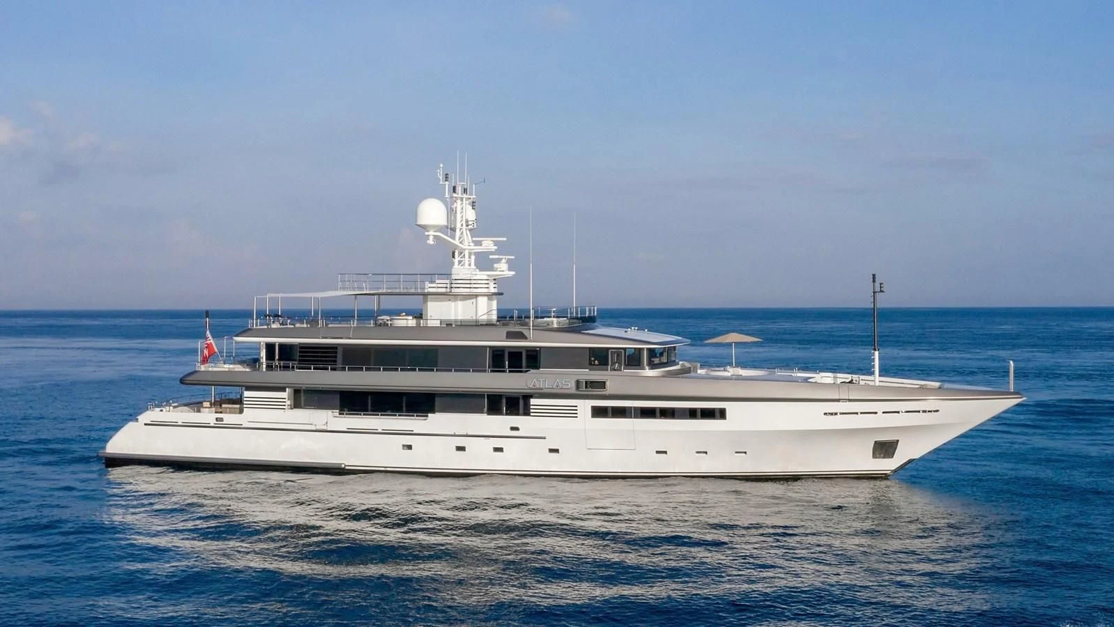 a large white boat in the water aboard ATLAS Yacht for Sale