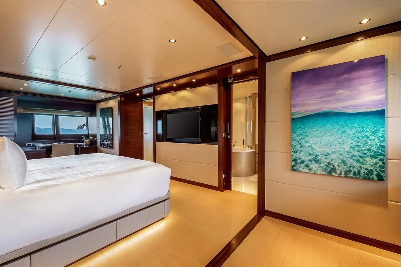 a room with a bed and a tv aboard ATLAS Yacht for Sale