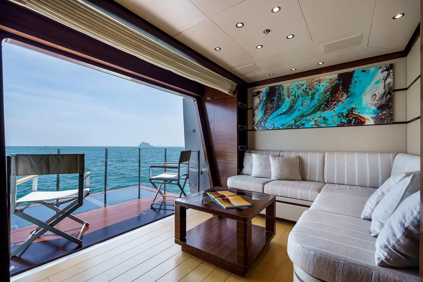 a living room with a large balcony aboard ATLAS Yacht for Sale