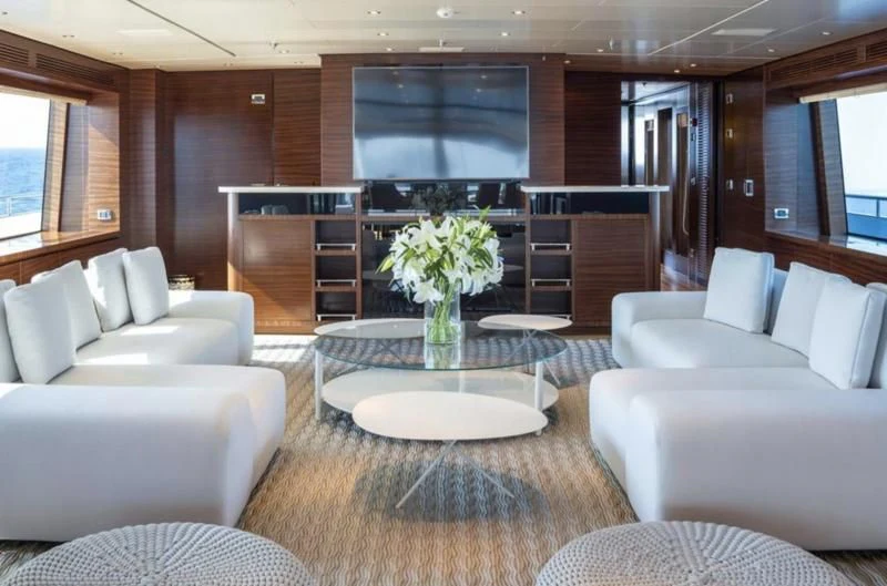 a living room with a large screen aboard ATLAS Yacht for Sale
