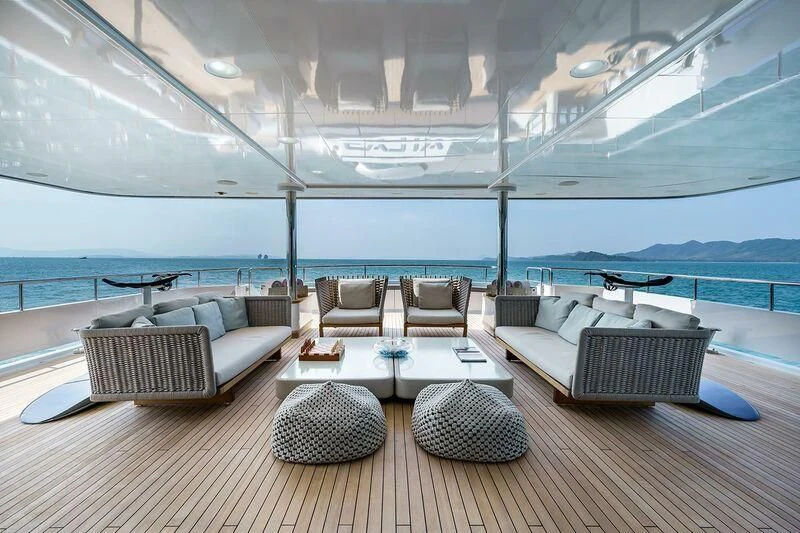 a room with a couch and a table and chairs aboard ATLAS Yacht for Sale