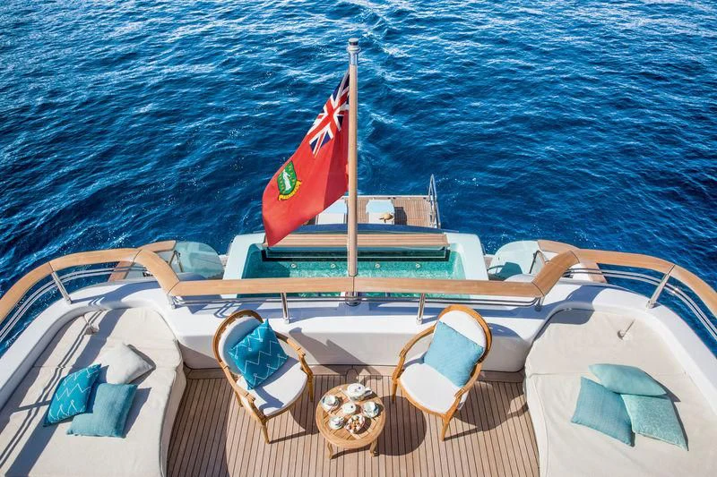 a boat with a flag on the front aboard LATONA Yacht for Sale