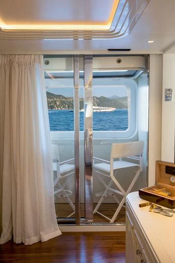 a room with a window and a curtain aboard LATONA Yacht for Sale