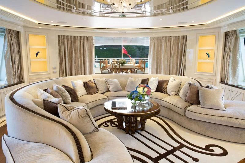 a living room with a couch and a coffee table aboard LATONA Yacht for Sale