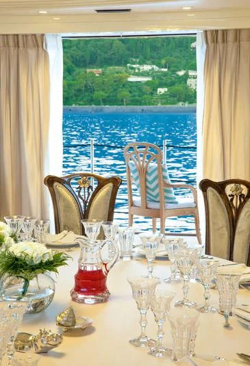 a table set for a dinner aboard LATONA Yacht for Sale