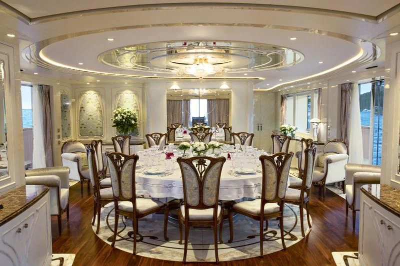 a dining table set for a formal dinner aboard LATONA Yacht for Sale