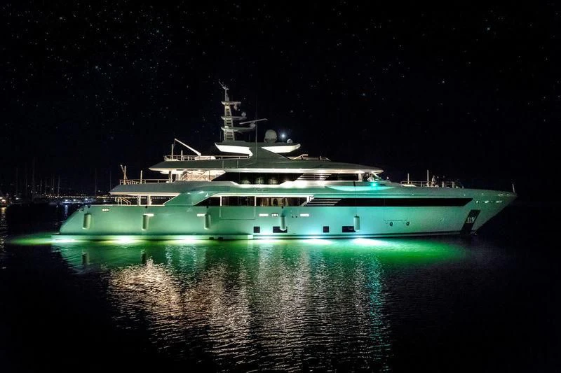 a large cruise ship at night aboard LATONA Yacht for Sale