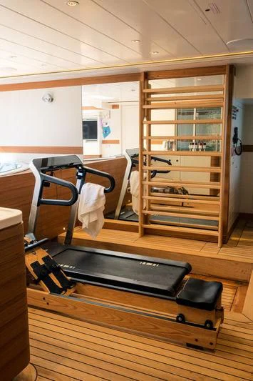 a wooden cabinet with a shelf aboard LATONA Yacht for Sale