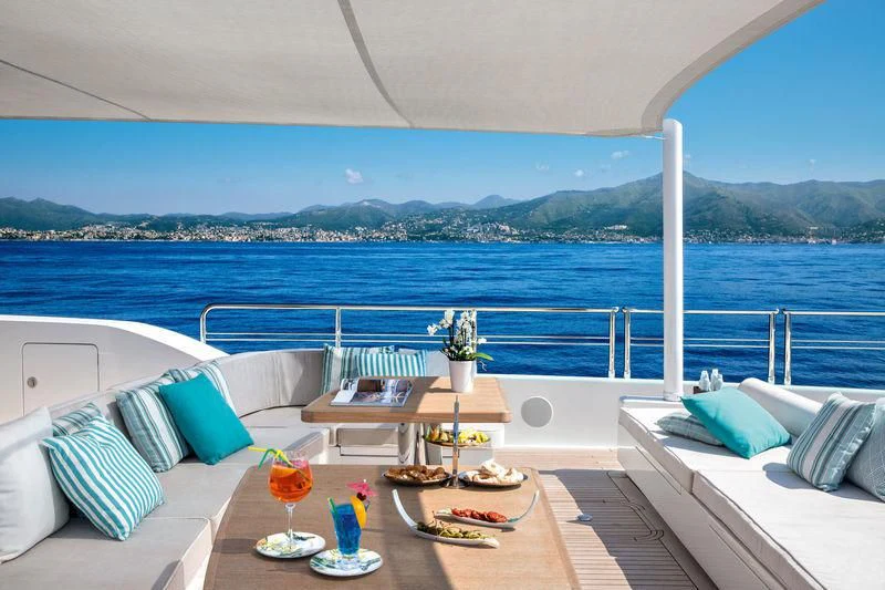 a room with a view of the ocean and a beach aboard LATONA Yacht for Sale