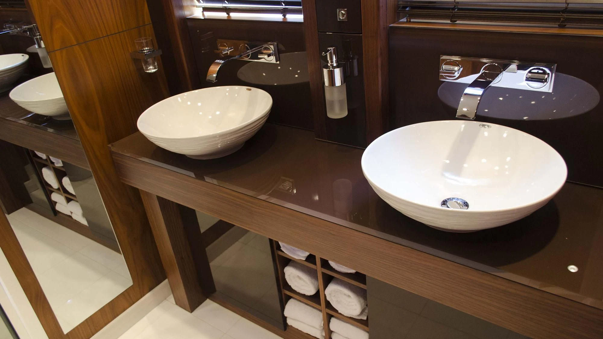 a bathroom with sinks and mirrors aboard LATONA Yacht for Sale