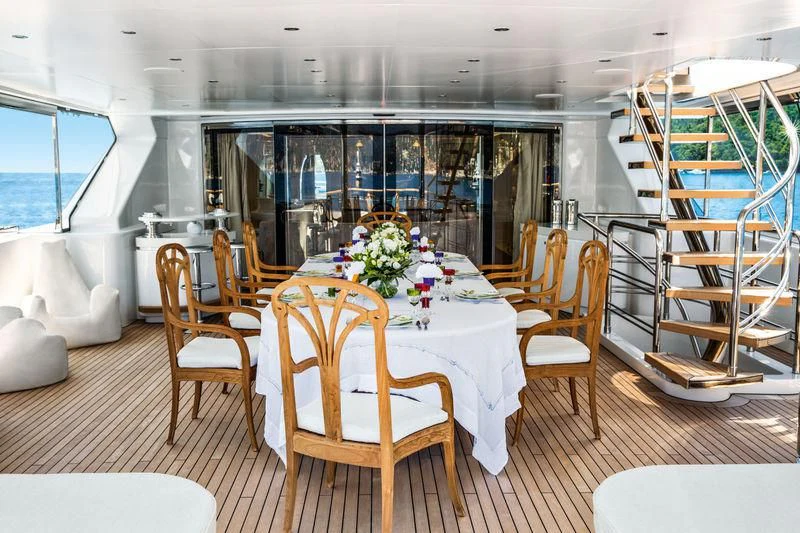 a dining table in a room aboard LATONA Yacht for Sale