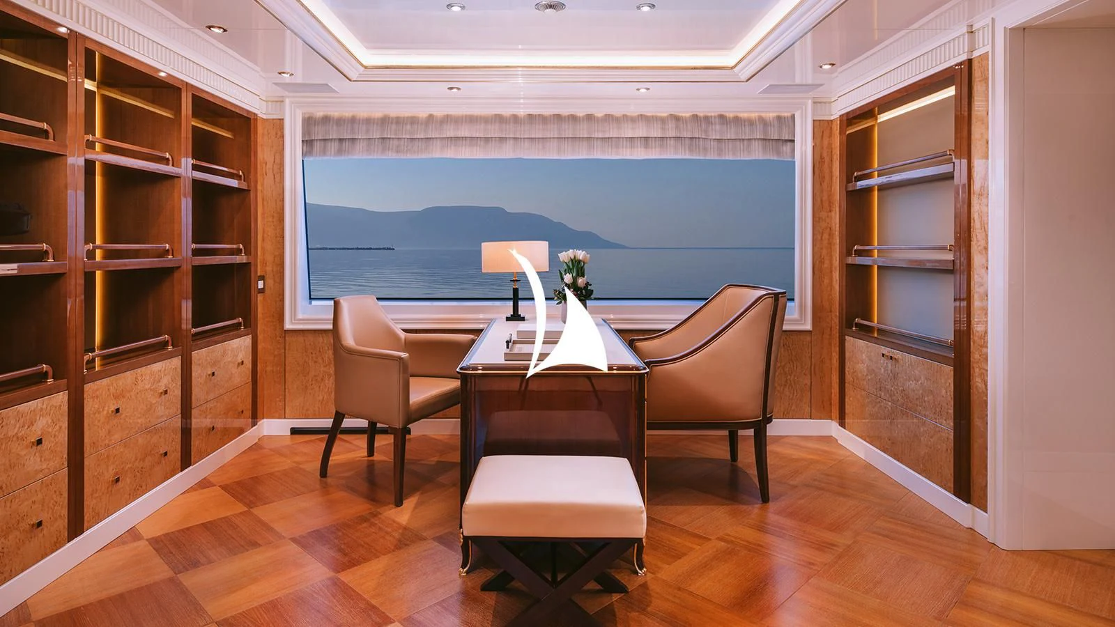 a room with a table and chairs aboard AELIA Yacht for Sale