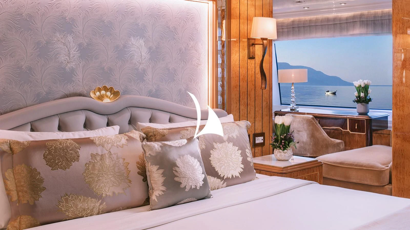 a bed with white pillows aboard AELIA Yacht for Sale