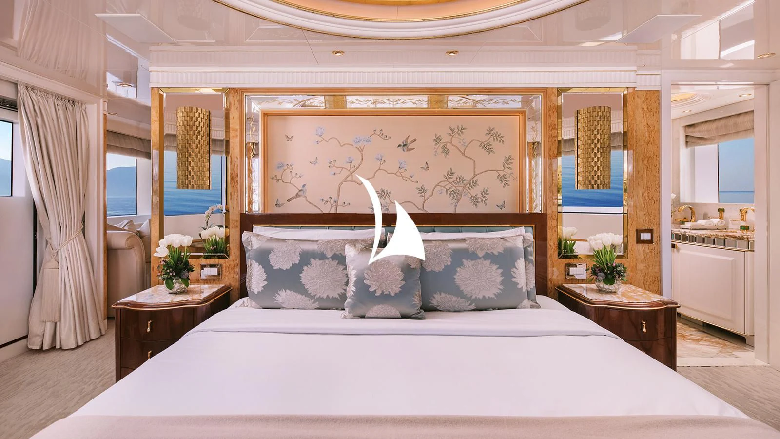 a bed with white sheets and pillows aboard AELIA Yacht for Sale