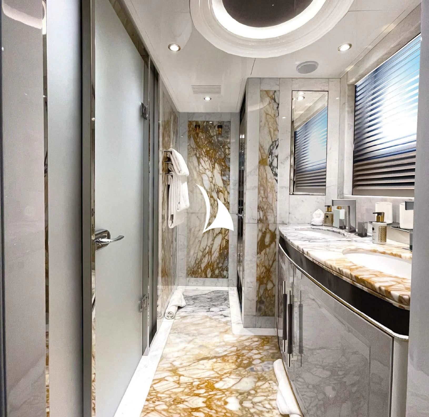 a bathroom with marble tiles aboard AELIA Yacht for Sale