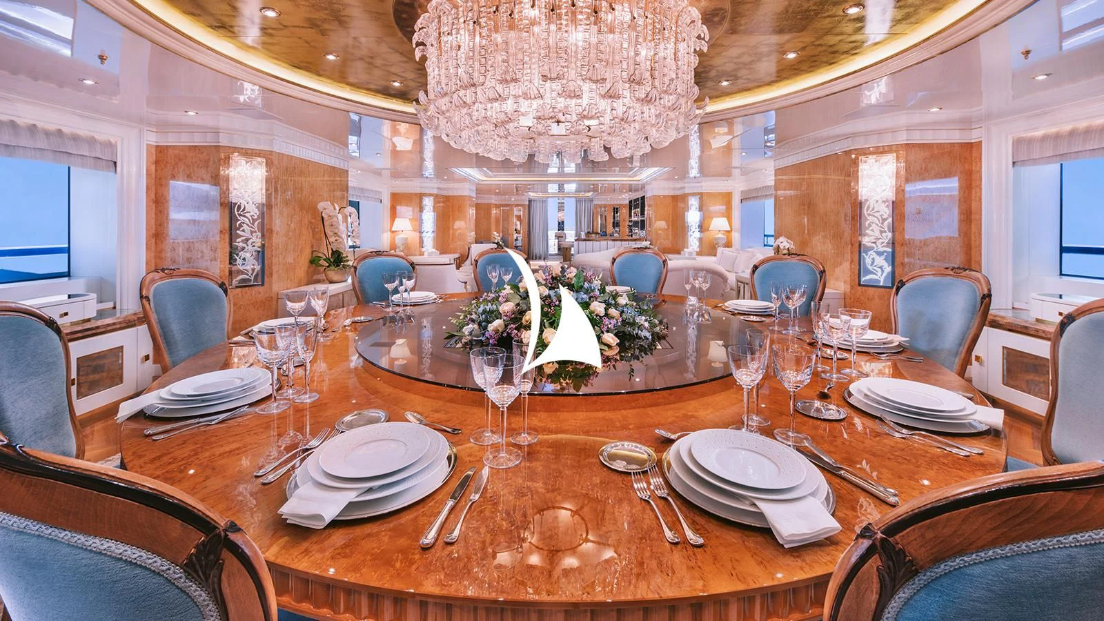 a dining room table set for a formal dinner aboard AELIA Yacht for Sale