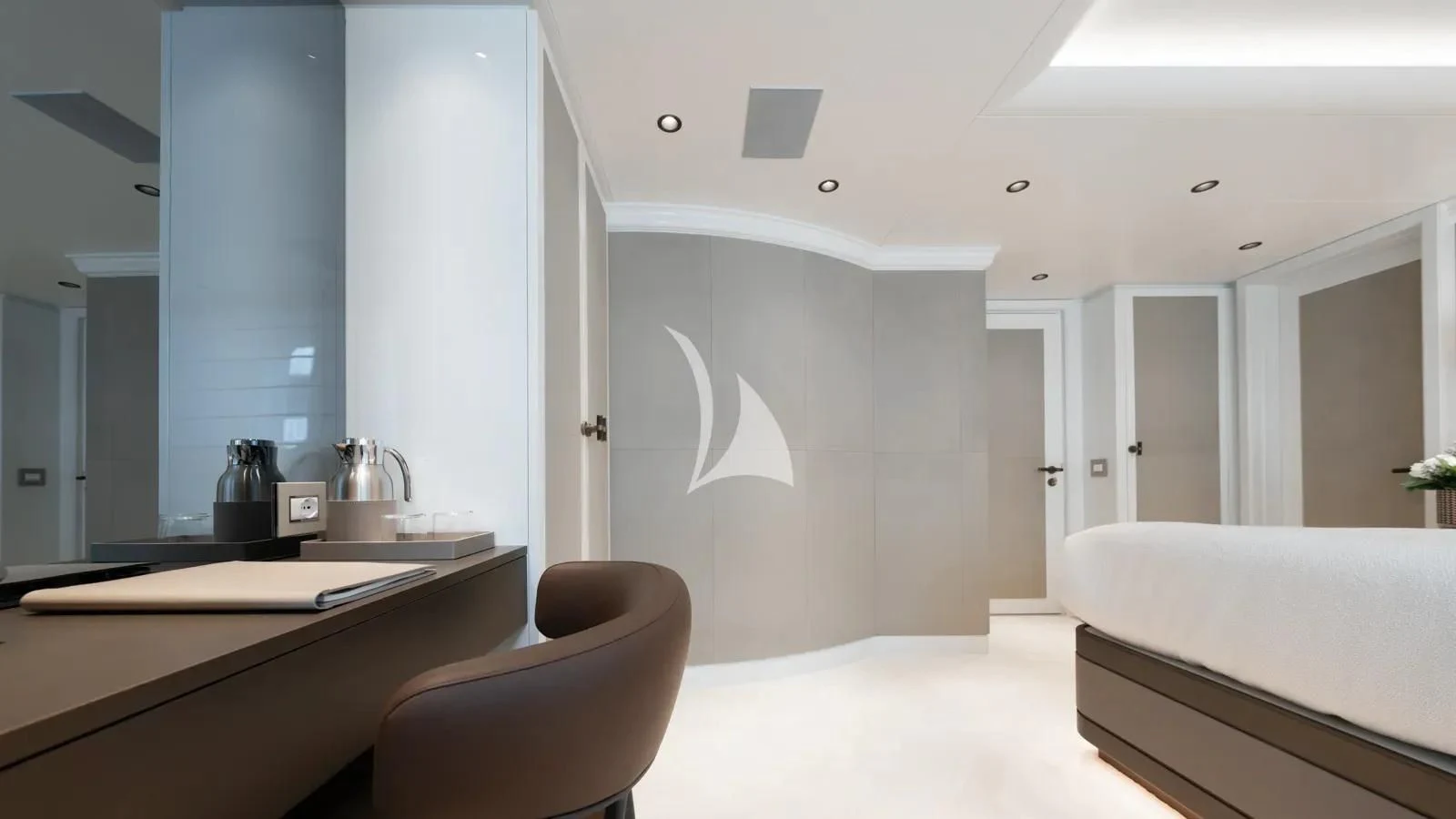 a room with a desk and a bed aboard AELIA Yacht for Sale