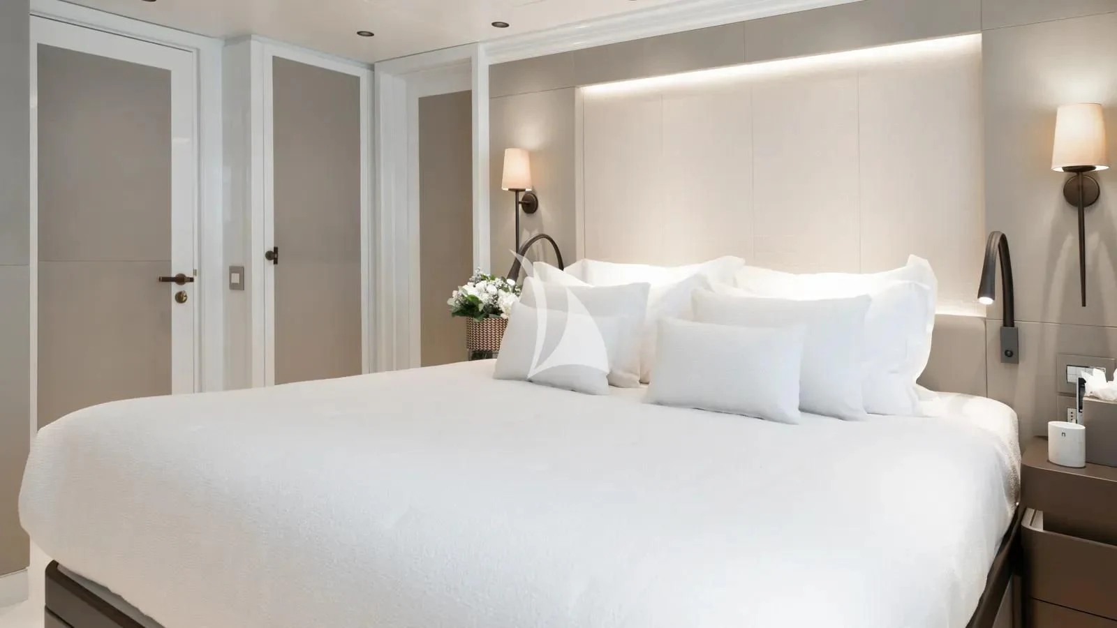 a bed with white sheets aboard AELIA Yacht for Sale