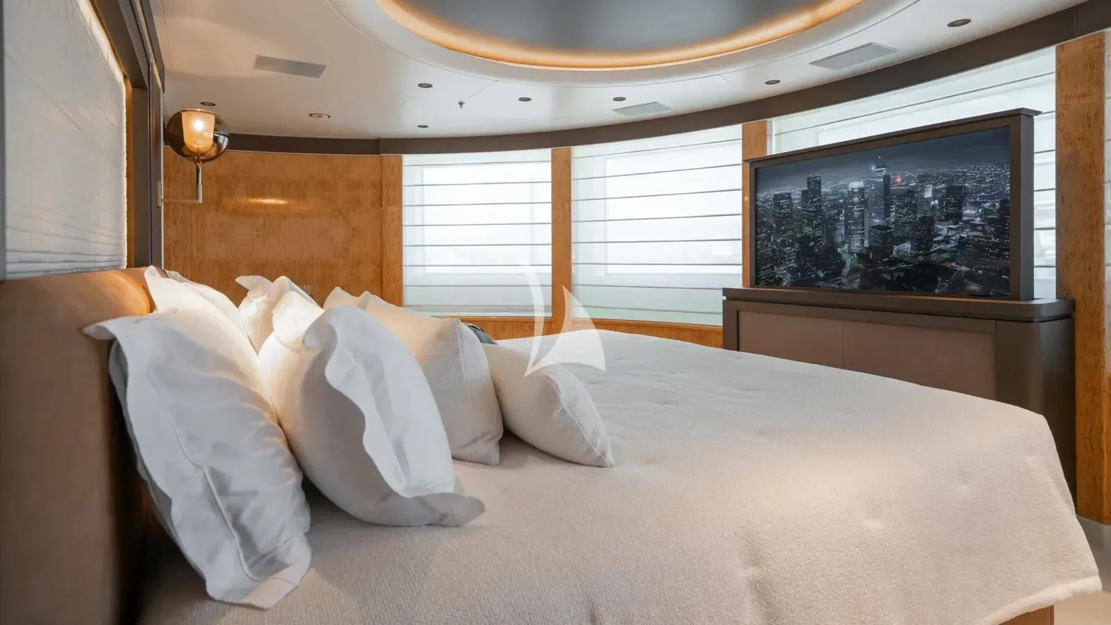 a bed with white pillows aboard AELIA Yacht for Sale