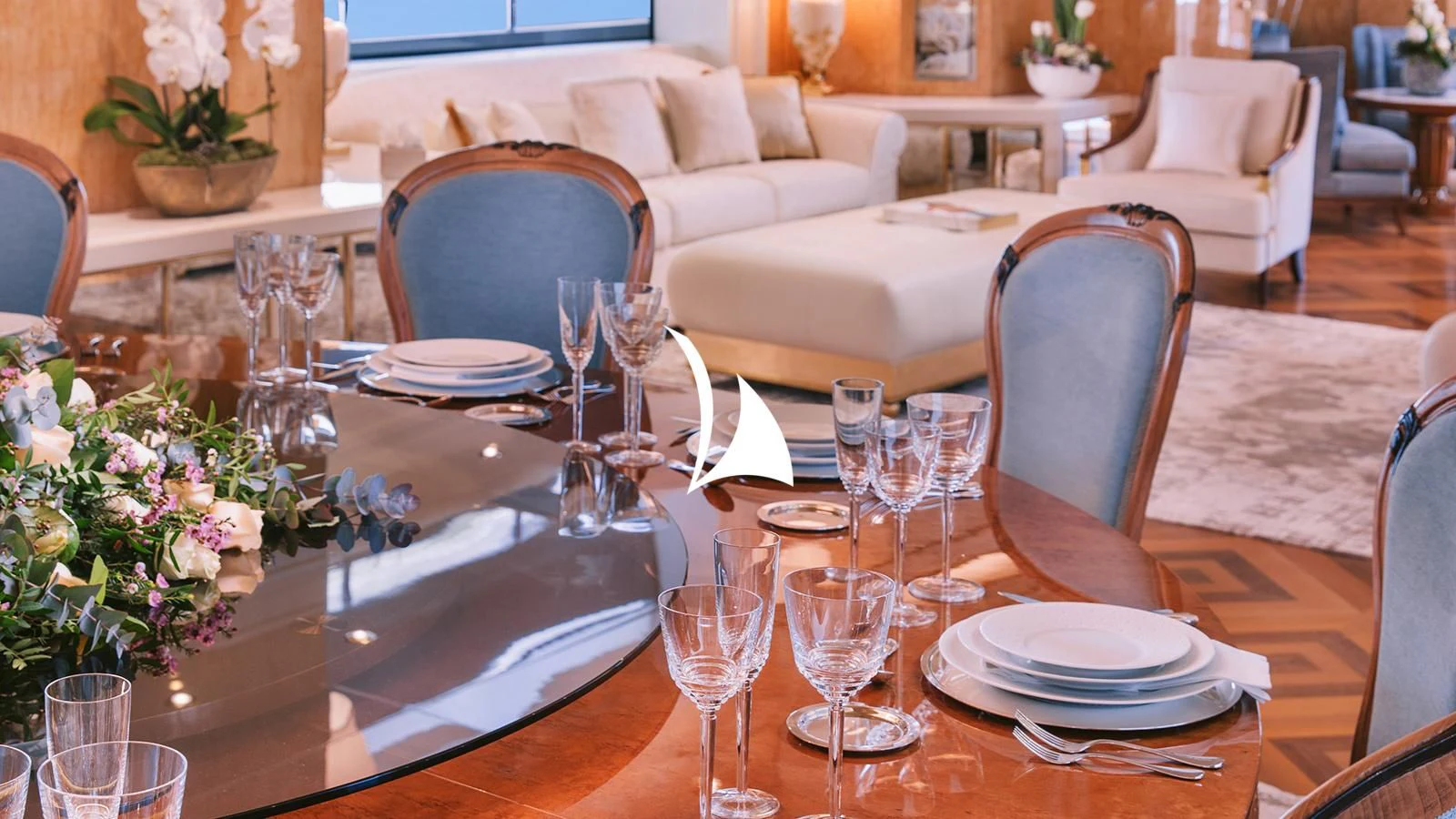 a table set with empty wine glasses aboard AELIA Yacht for Sale
