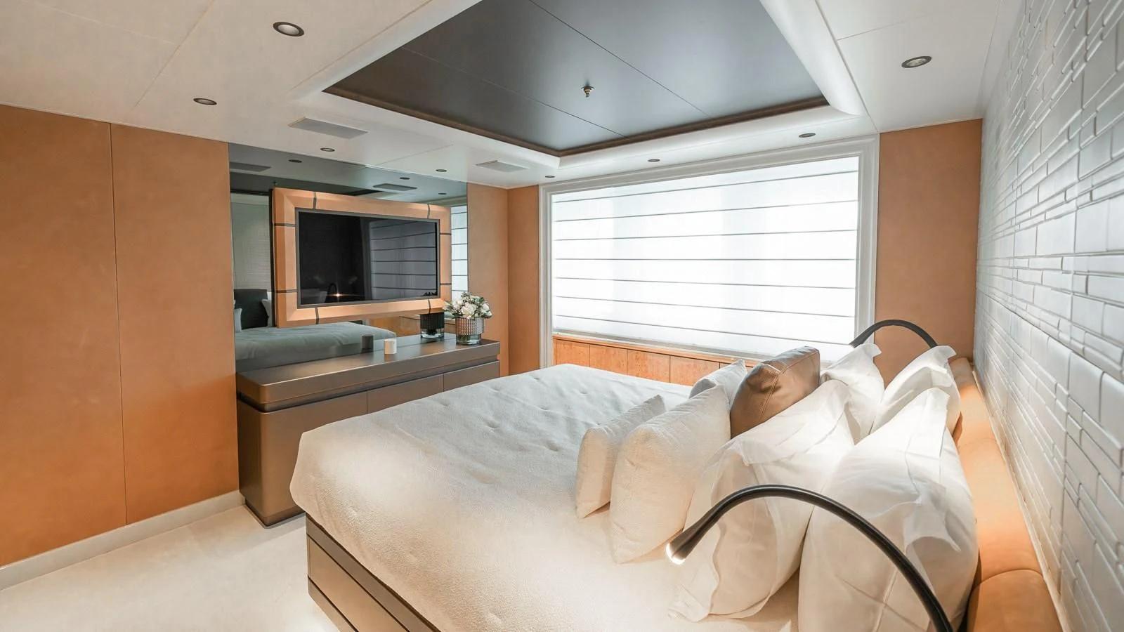 a person lying on a bed aboard AELIA Yacht for Sale