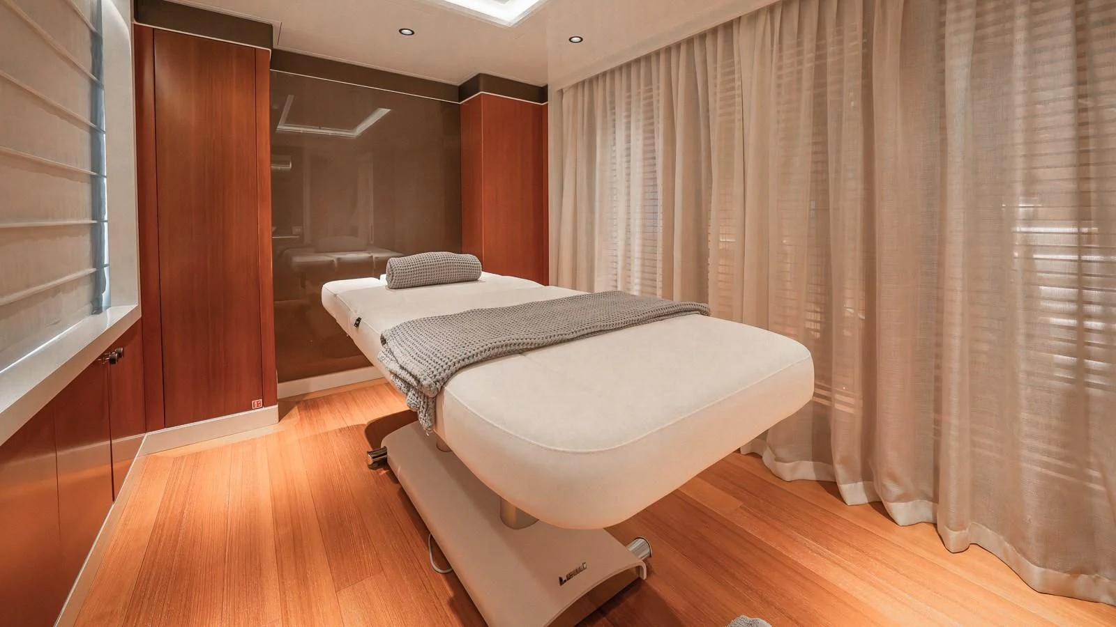 a room with a bed and a window aboard AELIA Yacht for Sale