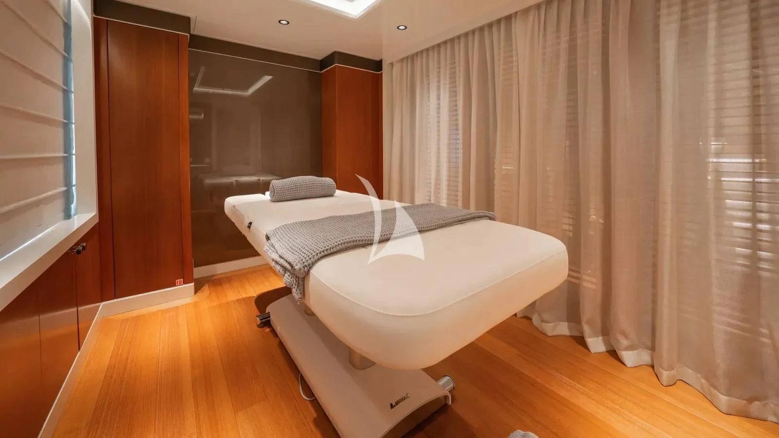 a room with a bed and a window aboard AELIA Yacht for Sale