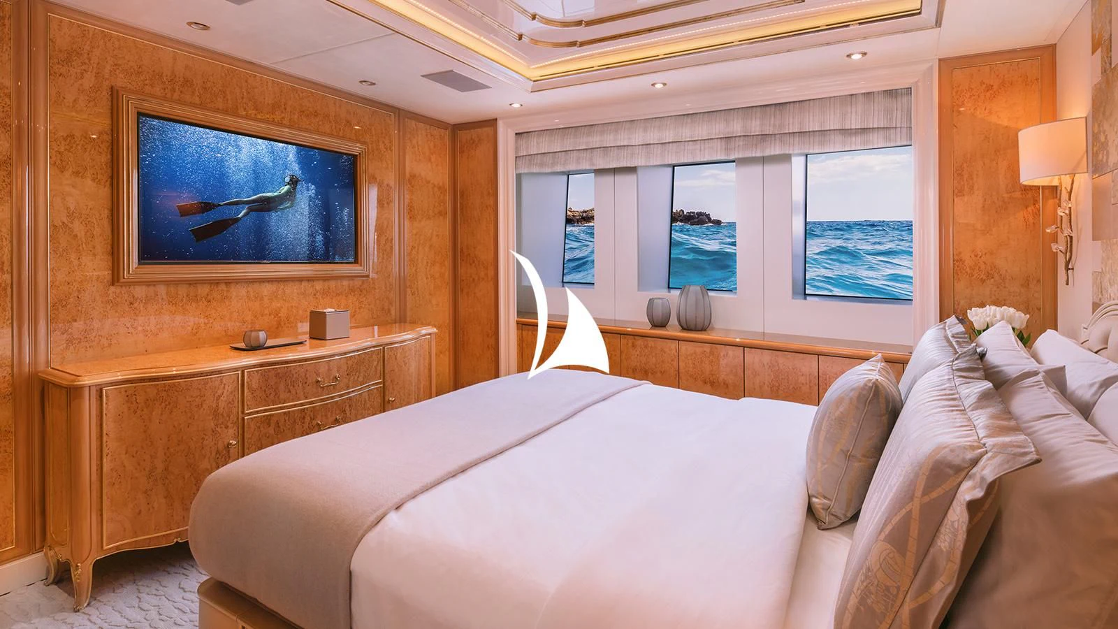 a bedroom with a bed and a television aboard AELIA Yacht for Sale