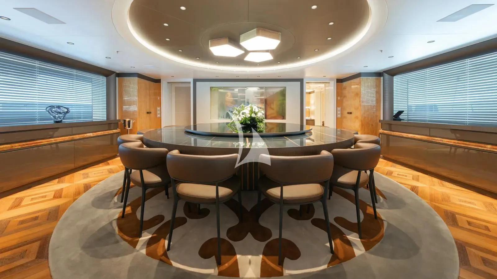 a room with a table and chairs aboard AELIA Yacht for Sale