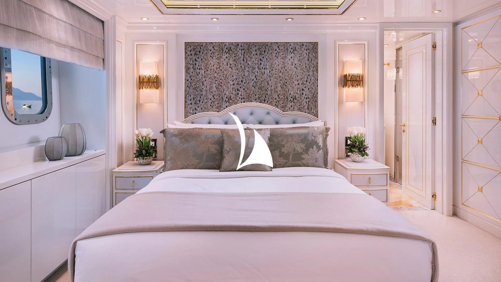 a bed with white sheets aboard AELIA Yacht for Sale