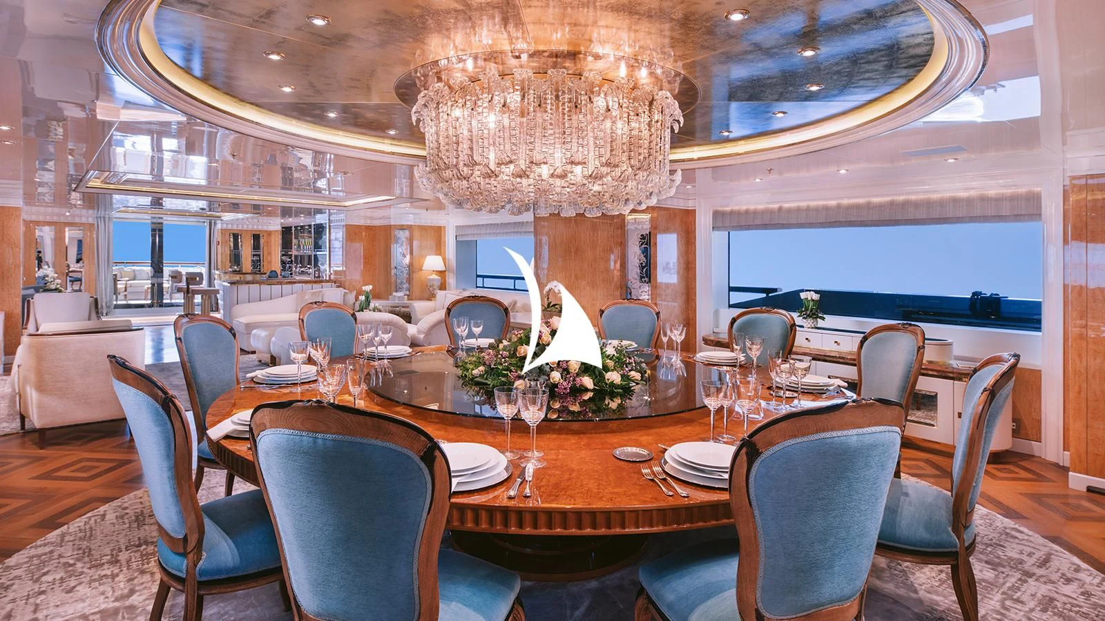 a dining room with a chandelier aboard AELIA Yacht for Sale