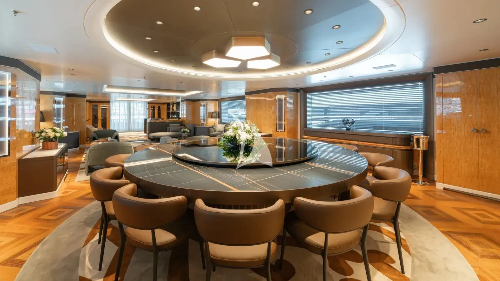 a large room with a table and chairs aboard AELIA Yacht for Sale