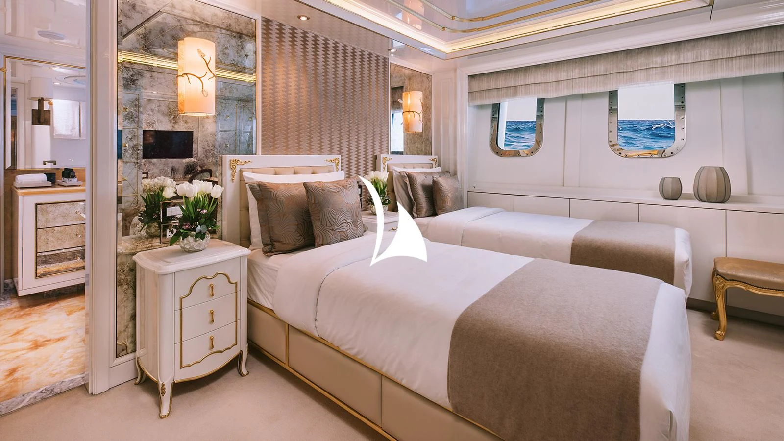 a room with a bed and a chair aboard AELIA Yacht for Sale
