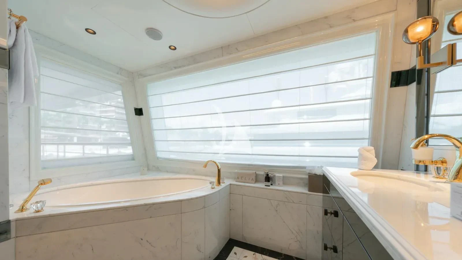 a bathroom with a tub and sink aboard AELIA Yacht for Sale