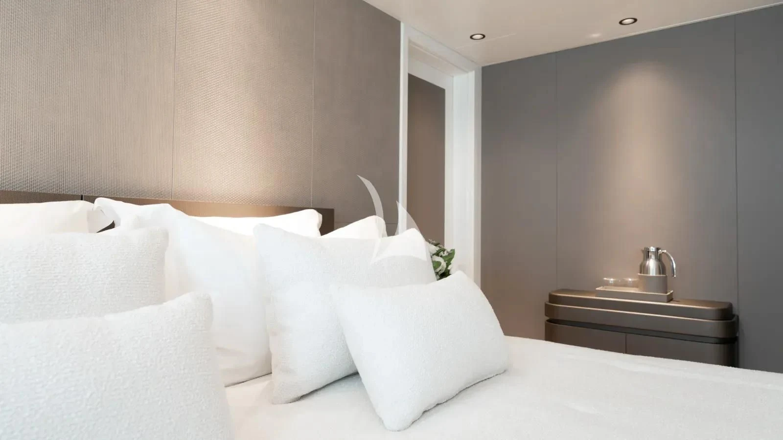 a bed with white pillows aboard AELIA Yacht for Sale