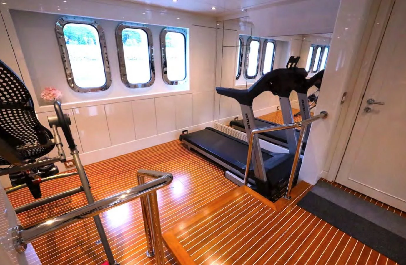 a room with a table and chairs aboard AELIA Yacht for Sale