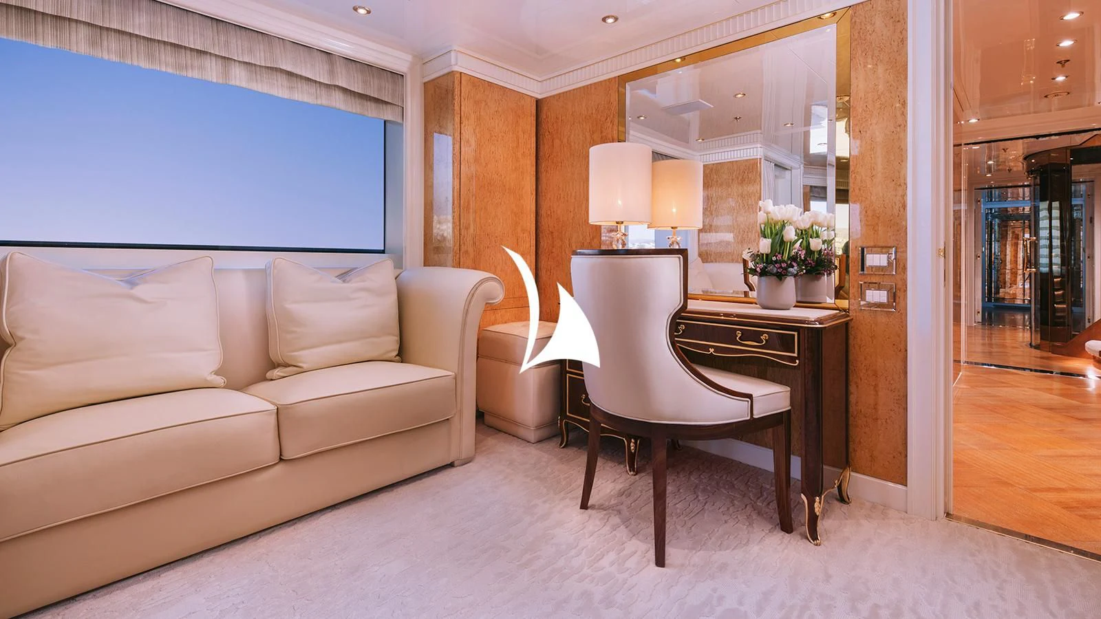 a living room with a couch and a table aboard AELIA Yacht for Sale