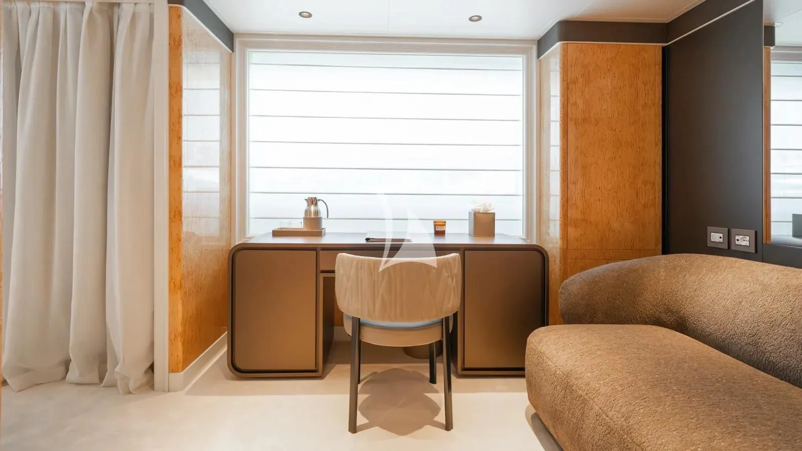 a room with a desk and a couch aboard AELIA Yacht for Sale