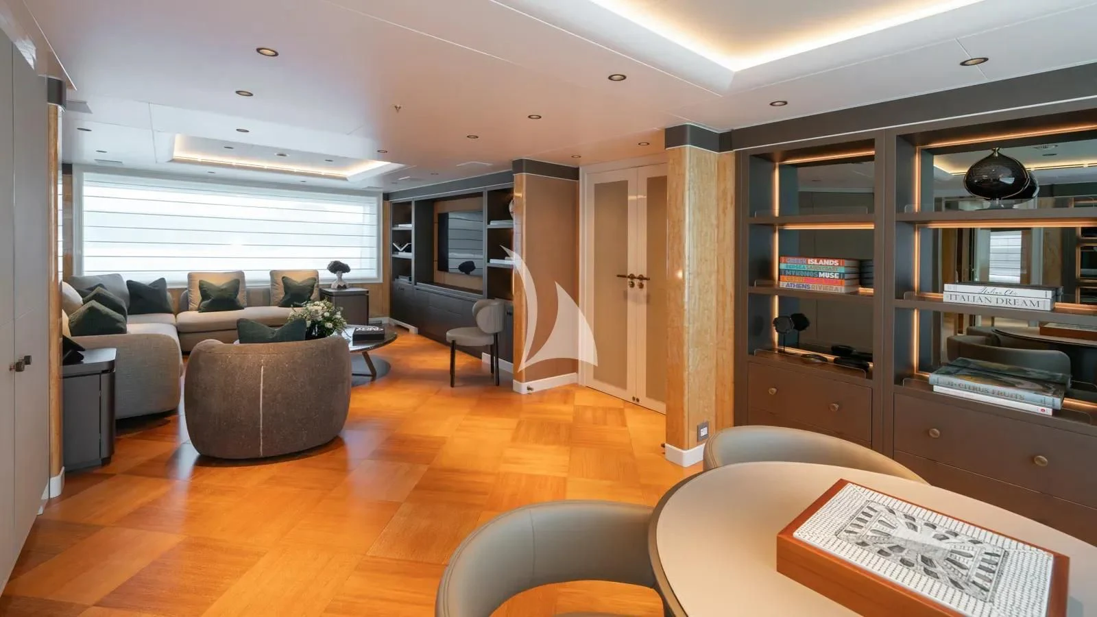a living room with a wood floor aboard AELIA Yacht for Sale