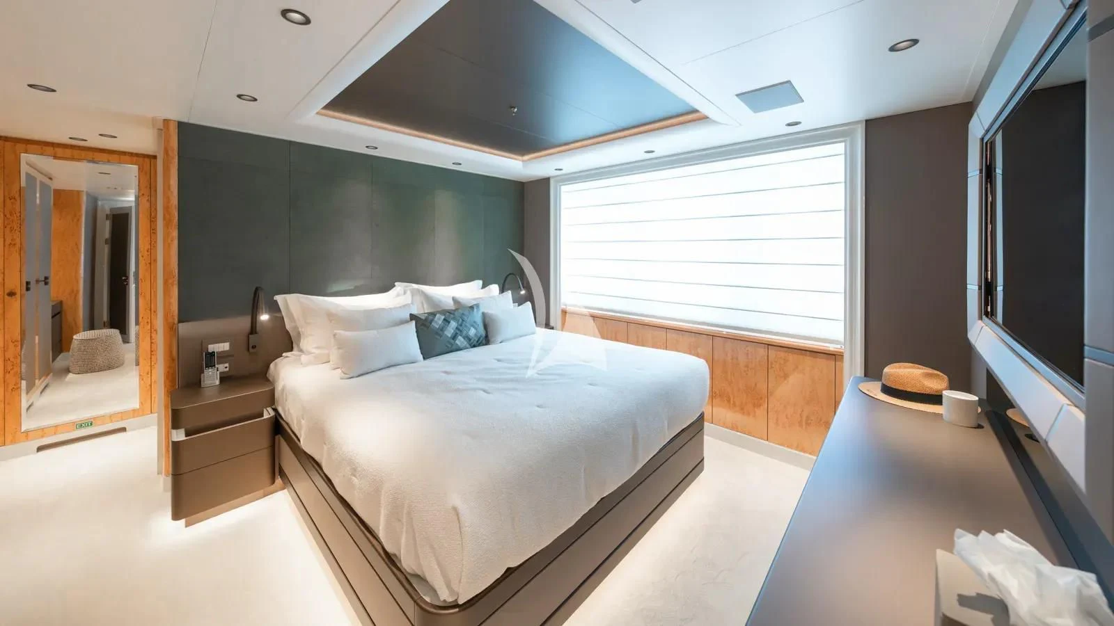 a large bedroom with a large bed aboard AELIA Yacht for Sale