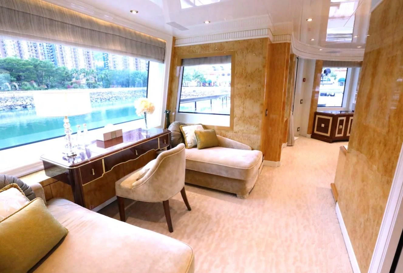 a living room with a table and couches aboard AELIA Yacht for Sale