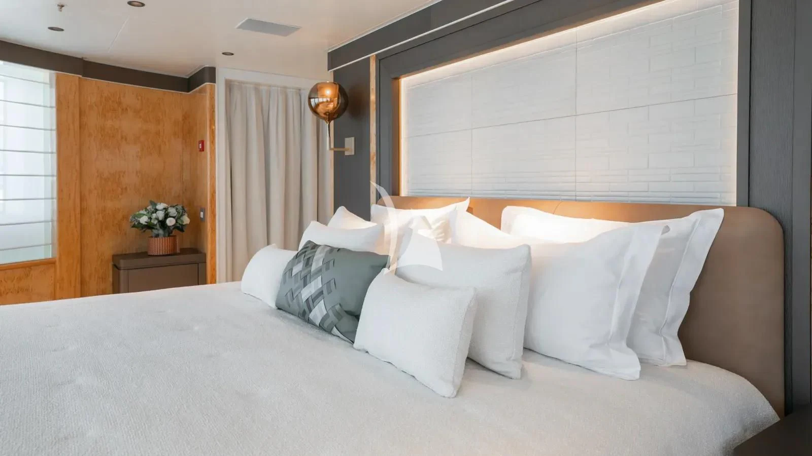 a bed with white pillows aboard AELIA Yacht for Sale