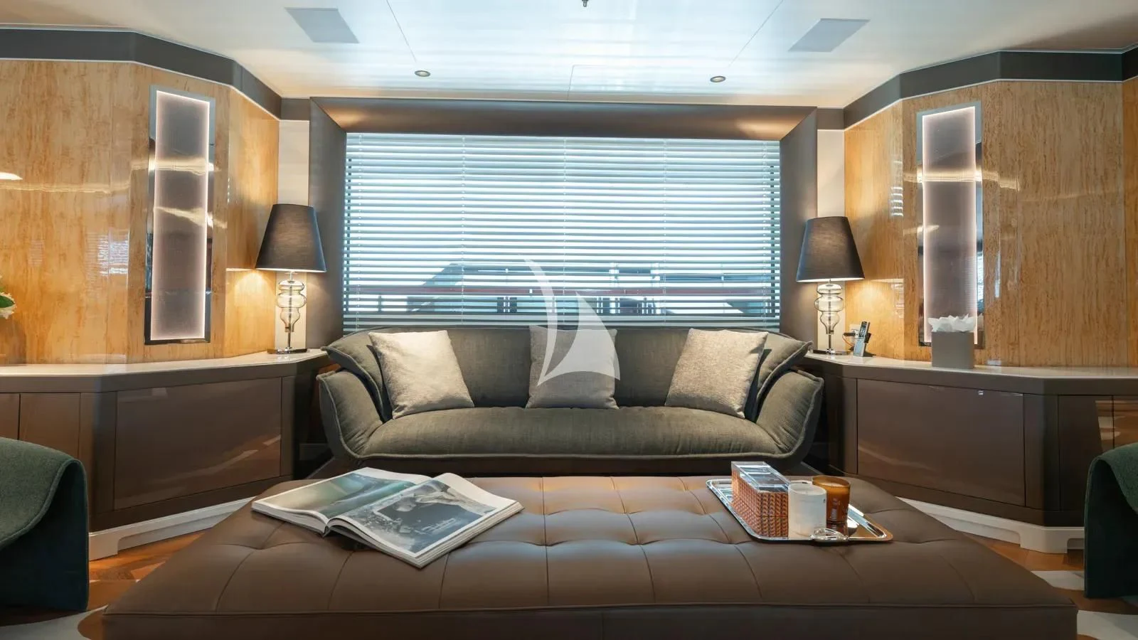 a living room with a couch and a coffee table aboard AELIA Yacht for Sale