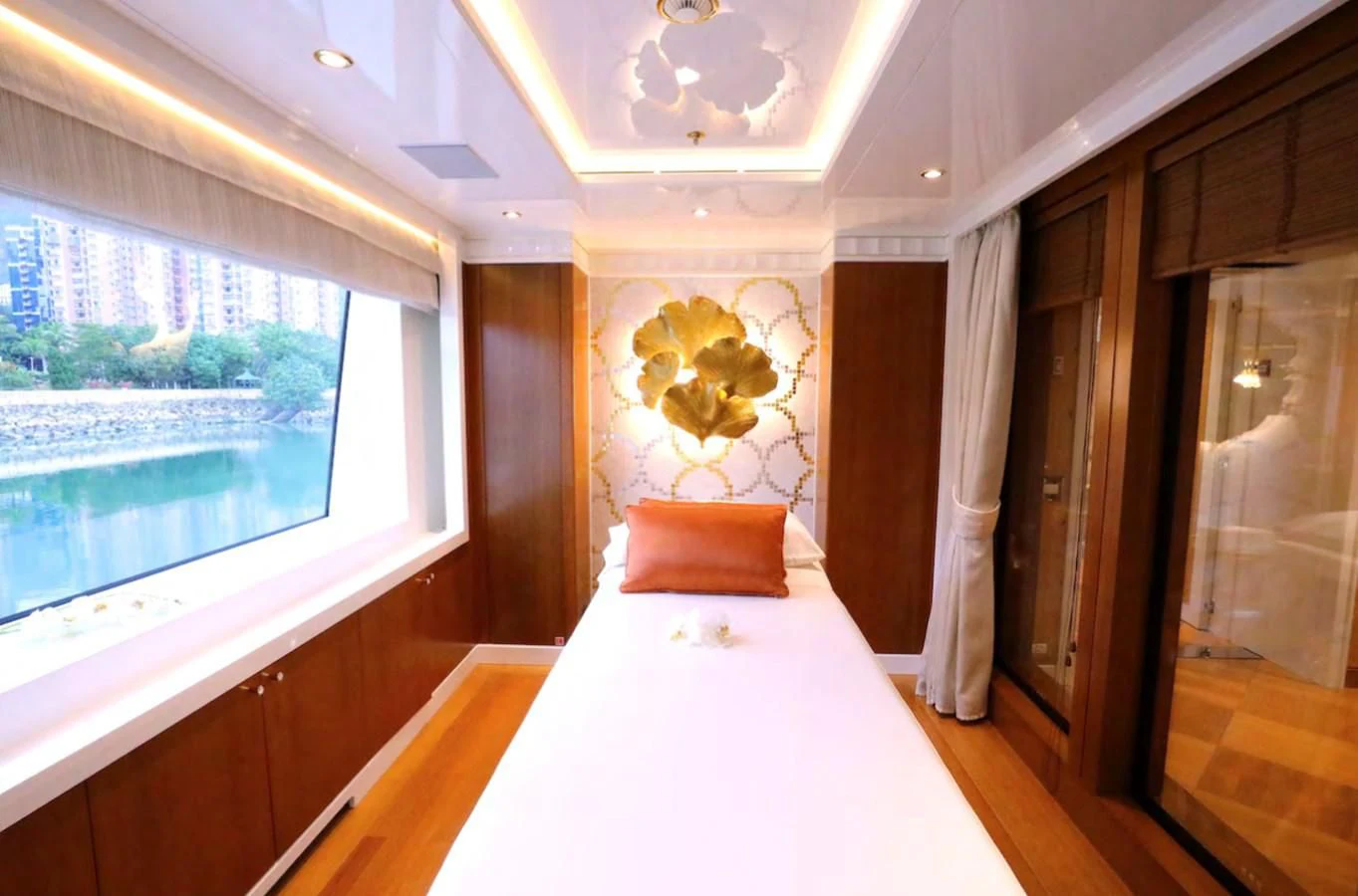 a room with a bed and a window aboard AELIA Yacht for Sale