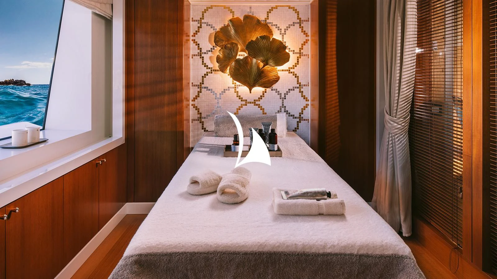 a hotel room with a large bed aboard AELIA Yacht for Sale