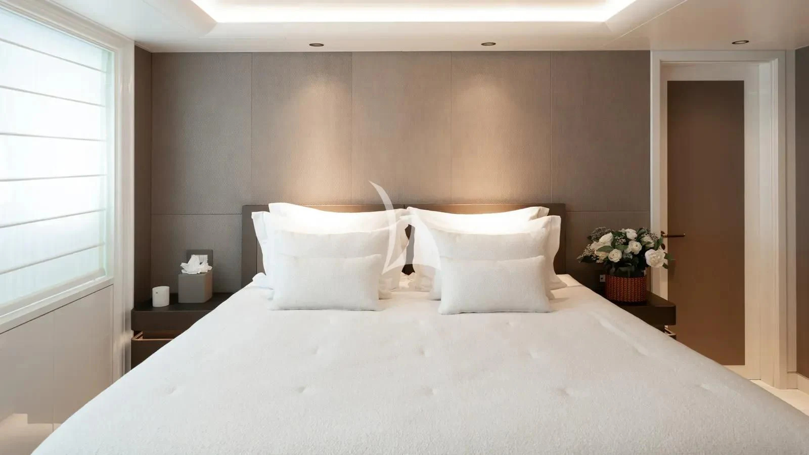 a bed with white pillows aboard AELIA Yacht for Sale