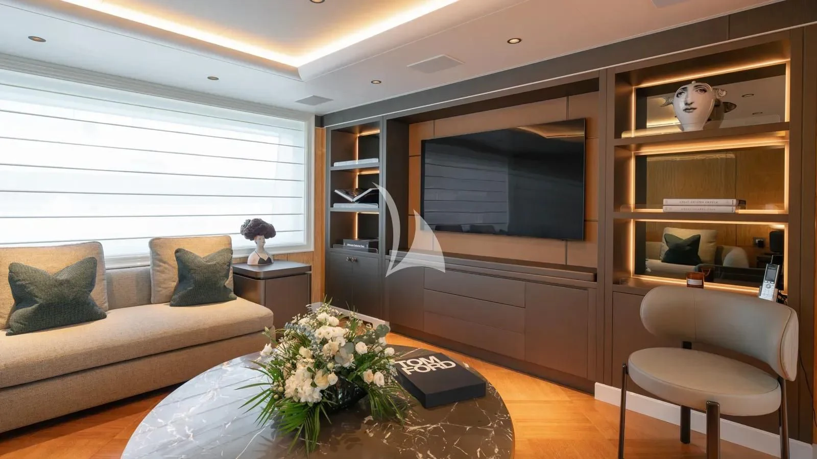 a living room with a couch and a tv aboard AELIA Yacht for Sale