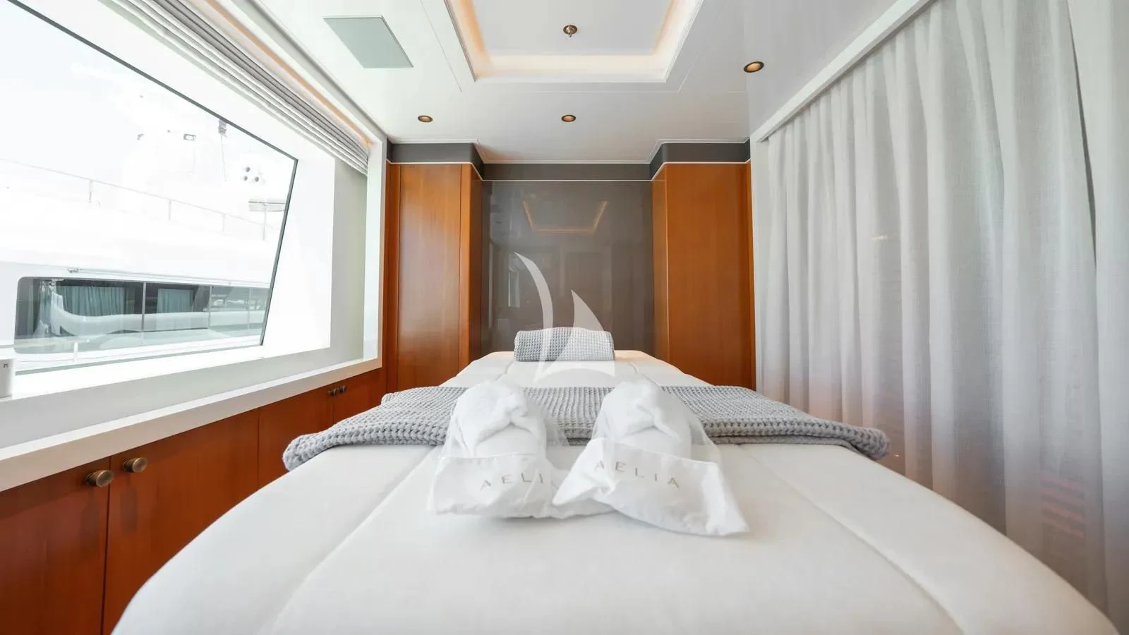 a bed with white sheets aboard AELIA Yacht for Sale