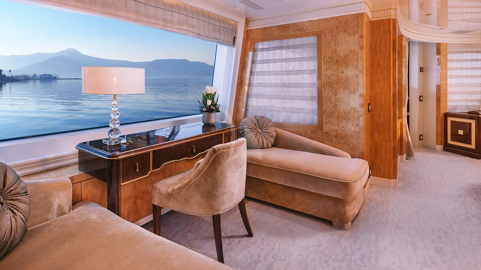 a living room with a couch and a table aboard AELIA Yacht for Sale