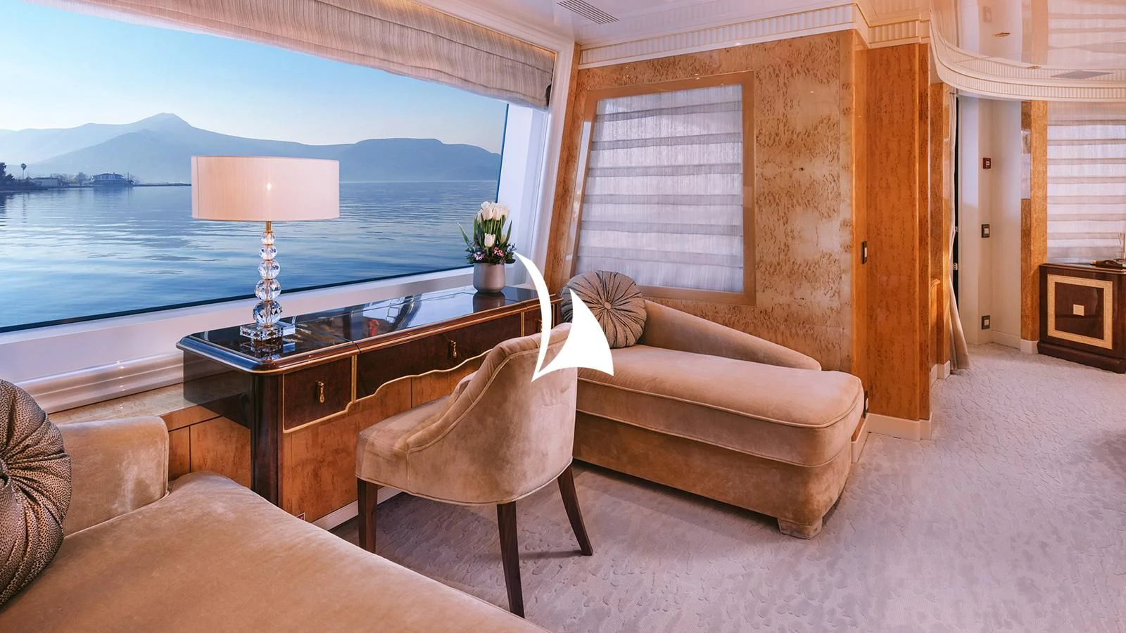 a living room with a table and chairs aboard AELIA Yacht for Sale